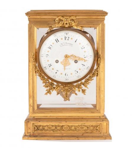 A Louis XVI style gilt bronze mantel clock