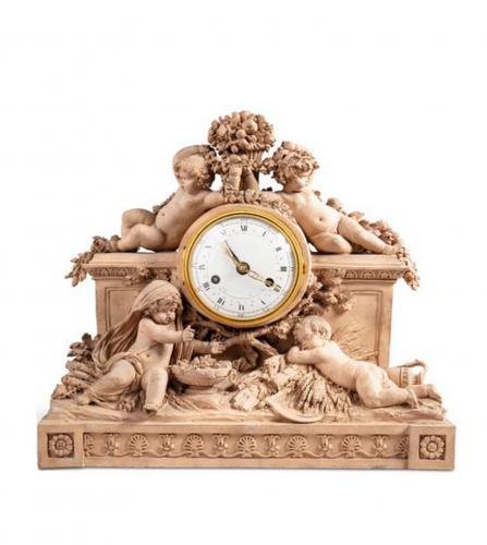 A terra cotta mantel clock