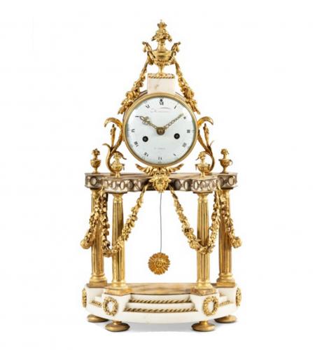 A Louis XVI white marble mantel clock