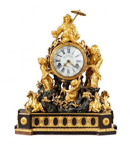 A Louis XV patinated mantel clock