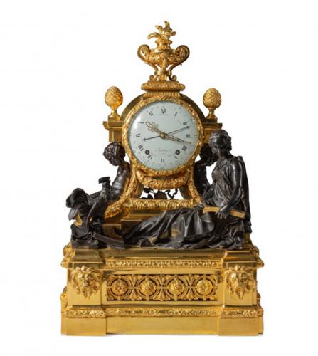 Louis XV A patinated and gilt bronze mantel clock