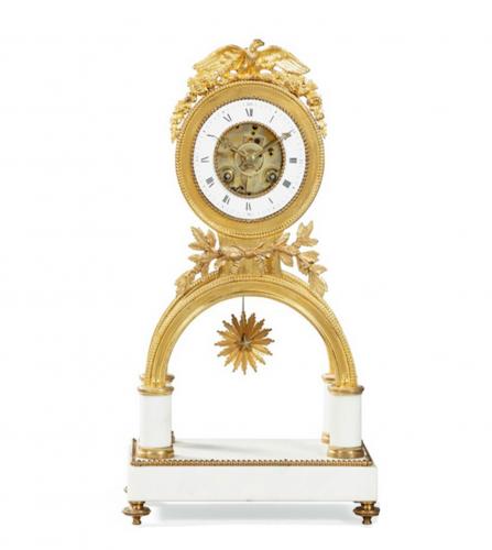 A gilt-bronze and white marble mantel clock