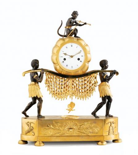 A RESTAURATION PATINATED GILT BRONZE PENDULE