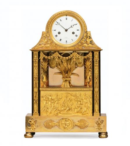 A CONSULAT PATINATED AND GILT BRONZE MANTEL CLOCK