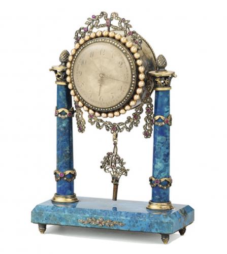 Small clock in lapis lazuli colored stones